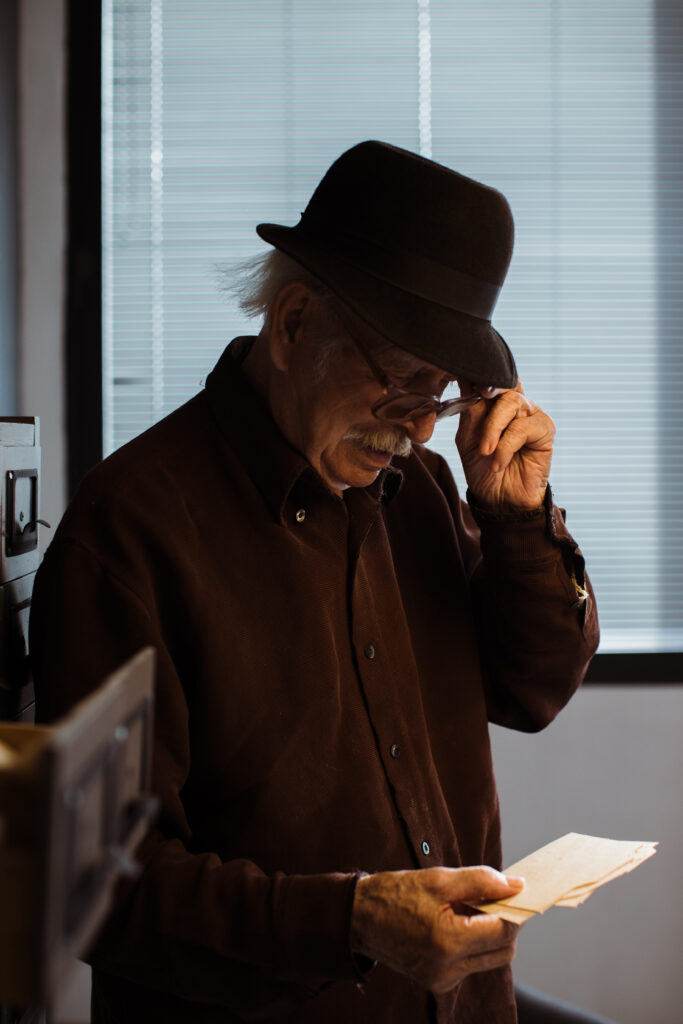 old man looking in information